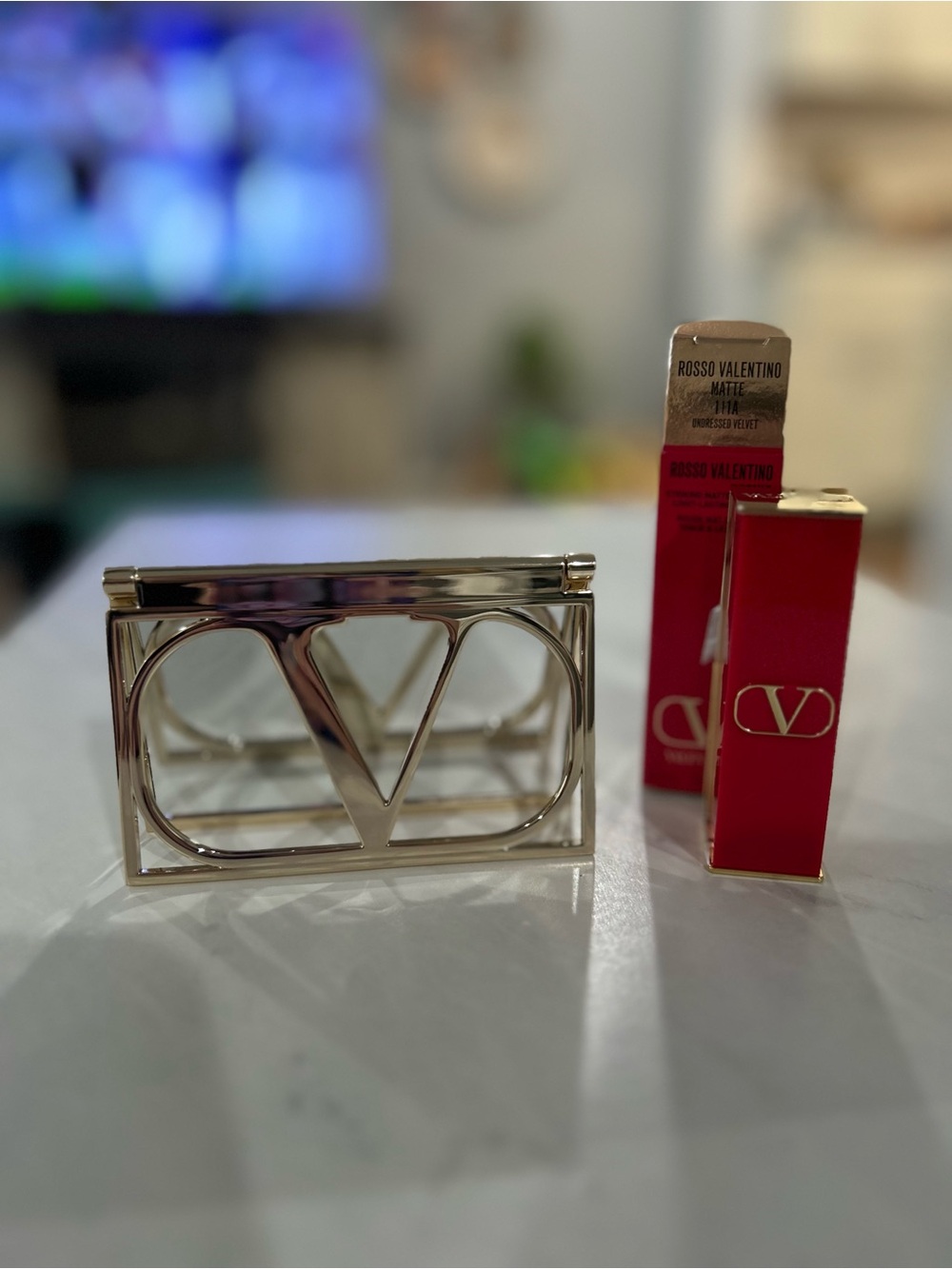 Valentino gold compact mirror with Valentino lipstick